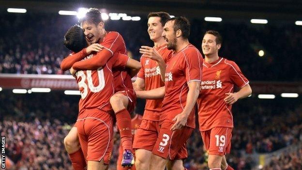 Suso celebrates with team-mates