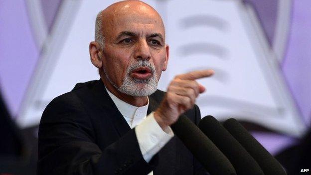 Afghan President Ashraf Ghani gestures as he speaks during an event to mark Teacher's Day at the Amani High School in Kabul, 15 October 2014