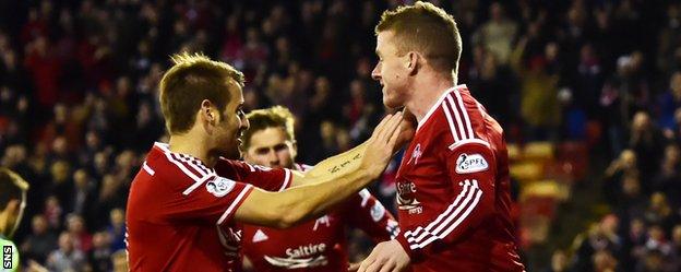 Niall McGinn and Jonny Hayes celebrate