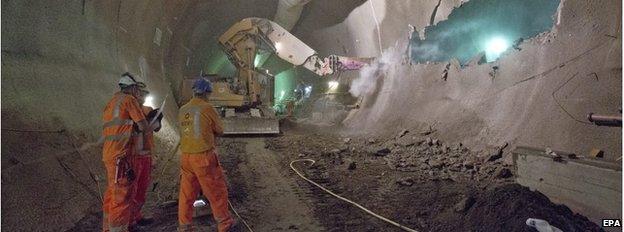 Workers in an underground Crossrail tunnel