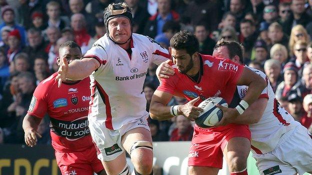 Toulon's oustanding centre Maxime Mermoz tries to break clear of Ulster's Roger Wilson