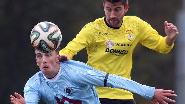 Institute's Paul McVeigh and Dungannon's Cameron Grieve