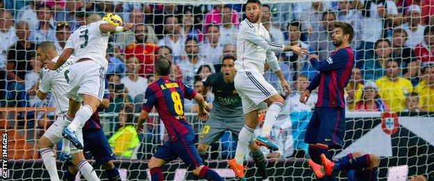 Real Madrid defender Pepe heads in his side's second goal against Barcelona