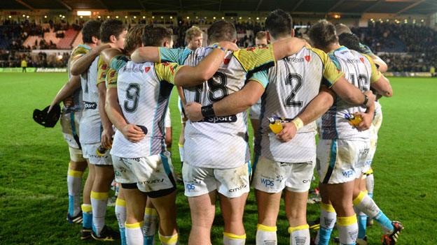 Ospreys in a huddle after their heavy defeat in Northampton