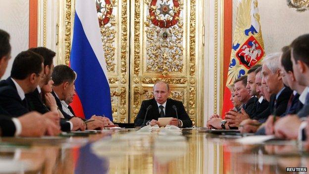 Russian President Vladimir Putin (C) speaks during a budget meeting with senior government officials in Moscow"s Kremlin June 28, 2012