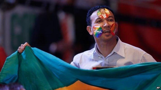 A supporter of Dilma Rousseff celebrates the election results in a hotel in Brasilia on 26 October, 2014