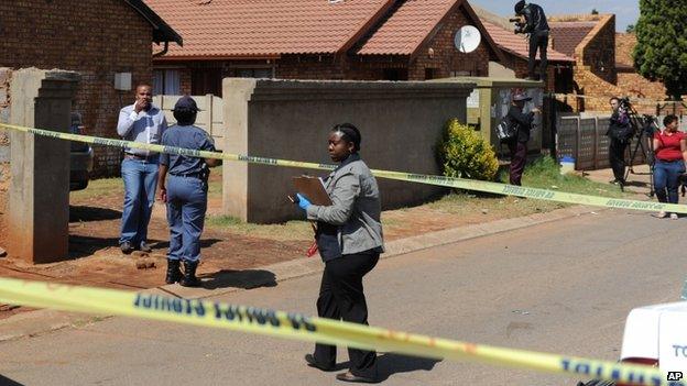 Police work outside the home ofKelly Khumalo, in Vosloorus, Johannesburg in South Africa on 27 October 2014