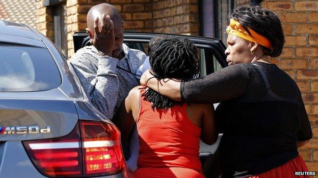 Family members of Kelly Khumalo in the township of Vosloorus, South Africa on 27 October 2014