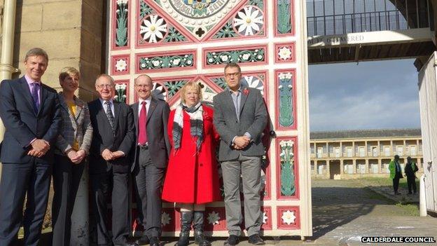 Gary Hughes of GRAHAM Construction, Angela Dowd of the Piece Hall Trust, Calderdale Council Leader Tim Swift, Michael Graham of GRAHAM Construction, Fiona Spiers of the Heritage Lottery Fund in Yorkshire and the Humber, and Councillor Marcus Thompson at the Piece Hall, Halifax