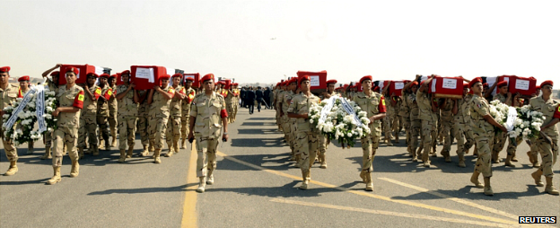 Soldiers in Cario carry the coffins of fellow soldiers killed in an attack in Sinai last week - 25 October 2014