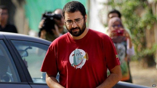 Alaa Abdel-Fattah arrives outside a court in Cairo - 26 October 2014