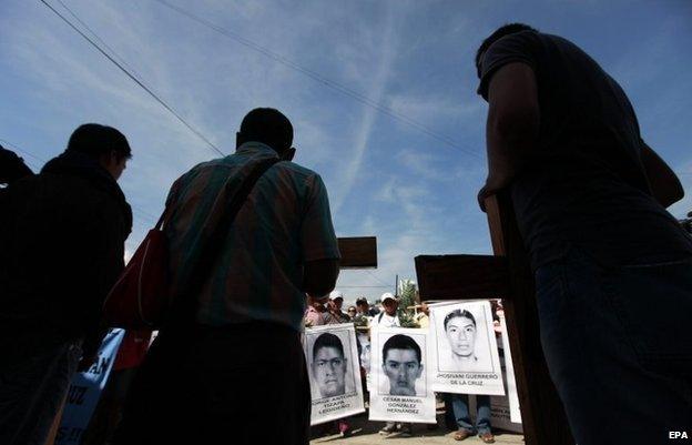 Relatives of the 43 missing students attend a mass at the same place where three students were killed on 26 September