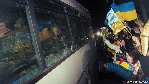 People welcoming soldiers