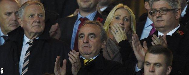 Former Newcastle United manager director Derek Llambias (centre) in the stand after becoming a Rangers consultant