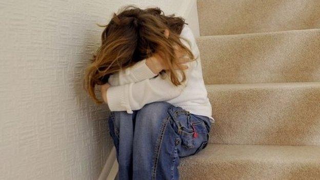 Child sitting on steps - anonymous