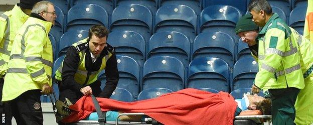 Rangers goalkeeper Steve Simonsen is stretchered off