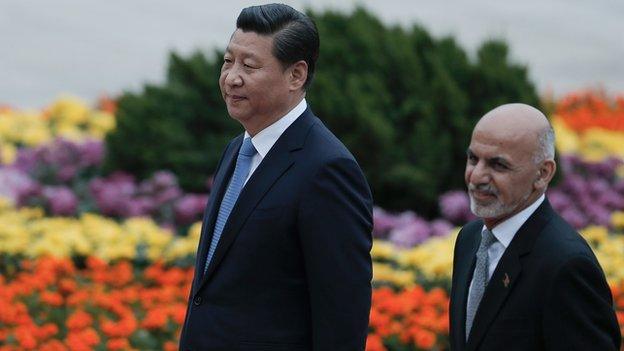 Wooing China: President Ashraf Ghani (r) is greeted by his host, President Xi Jinping