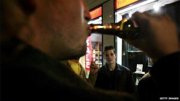 Man drinking in the street