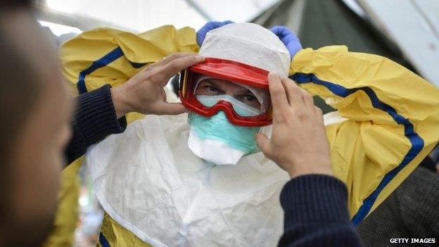 Health workers of the International Federation of Red Cross (IFRC) and medical charity Medecins Sans Frontieres (MSF) take part in a pre-deployment training for staff heading to Ebola areas 29 October 2014