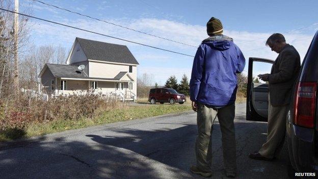 Members of the media wait outside the home of Theodore Wilbur, boyfriend of Kaci Hickox, the nurse who was released from New Jersey's mandatory quarantine for certain travellers from Ebola-stricken West Africa, in Fort Kent, Maine 29 October 2014