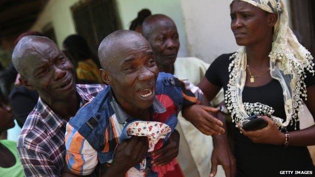 A grieving man in Liberia - October 2014