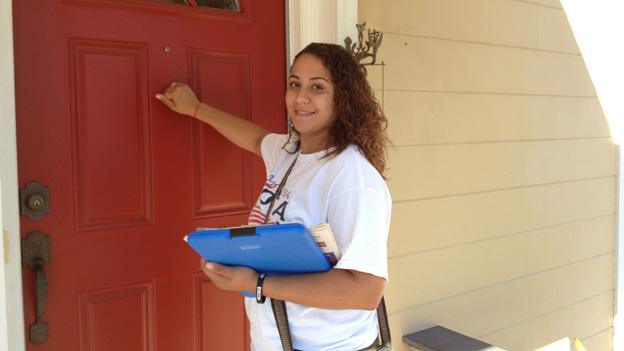 Woman knocking on a door