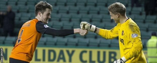 Radoslaw Cierzniak is congratulated by team-mate Jon Souttar