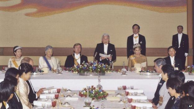 In this photo released by Imperial Household Agency of Japan, Japan’s Emperor Akihito, fourth left, gives a speech to welcome King Willem-Alexander, third left, and Queen Maxima, seated second right, as Empress Michiko, second left, Crown Prince Naruhito, seated right, Crown Princess Masako and guests listen at the start of a state dinner at the Imperial Palace in Tokyo Wednesday, on 29 October, 2014