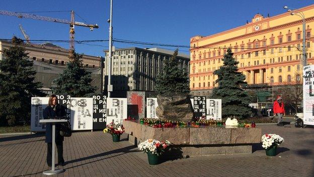 A woman gives a speech at the memorial for victims of political repression in Moscow