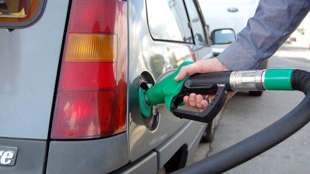 Man fills car with petrol