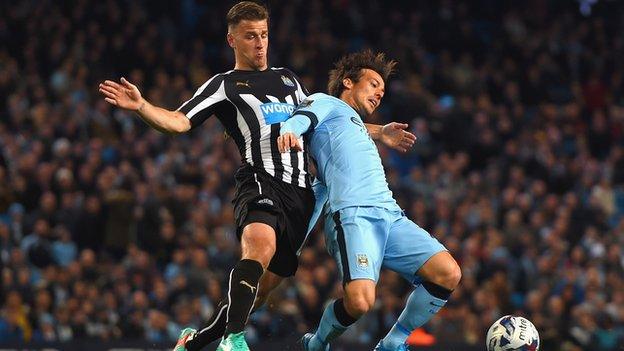 Newcastle United's Ryan Taylor battles with Man City's David Silva