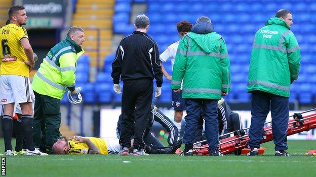 Alan McCormack (third from left) was stretchered off with an ankle injury at Bolton