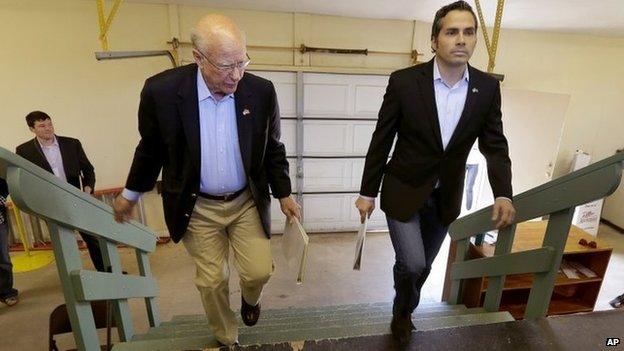 Republican Senator Pat Roberts, left, and Greg Orman walk to the stage before a Senate debate in Hutchinson, Kansas 6 October 2014