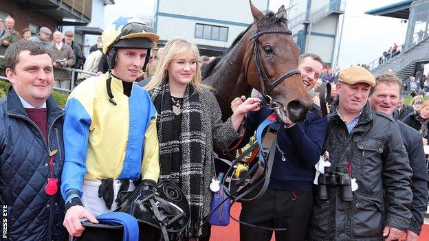 Jockey Mark Walsh with Little King Robin and the mare's connections after her WKD Hurdle triumph