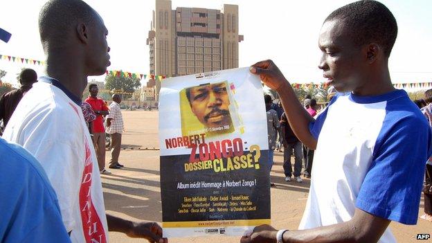 File photo: Demonstrators show a poster with a portrait of late journalist Norbert Zongo, who was killed 10 years ago, during a protest in Ouagadougo, 13 December 2008