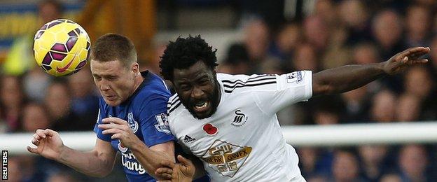 Everton midfielder James McCarthy (left) and Swansea striker Wilfried Bony