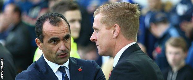 Everton manager Roberto Martinez (left) and Swansea boss Garry Monk