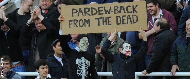 Newcastle fans with a 'Pardew - back from the dead' banner