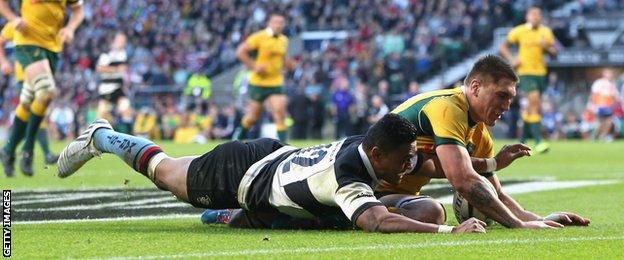 Francis Saili of the Barbarian beats Sean McMahon to the ball to score a try