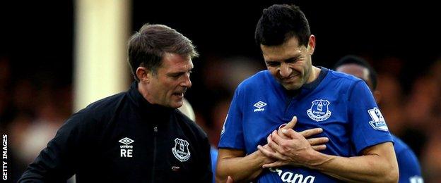 Everton defender Antolin Alcaraz goes off injured against Swansea