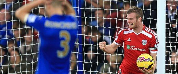 Chris Brunt celebrates after Esteban Cambiasso's own goal gave West Brom the lead