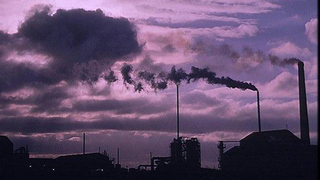 Chimneys billowing smoke