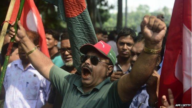 Activists and former freedom fighters celebrate following the sentencing against Jamaat-e-Islami party leader Mir Quasem Ali in Dhaka, Bangladesh on 2 November 2014