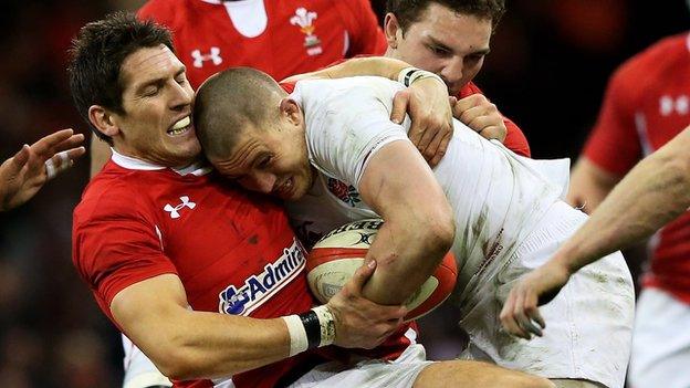 James Hook tackles England's Mike Brown in March 2013