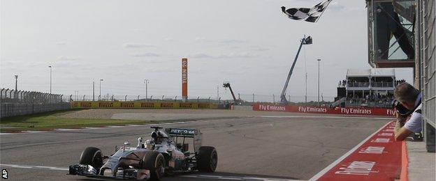 Lewis Hamilton crosses the line to win the US Grand Prix