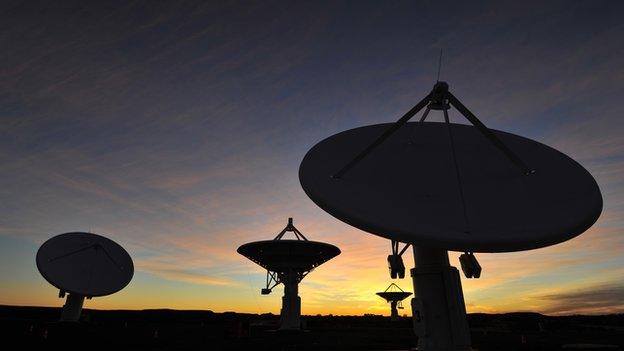 A picture taken on 4 July 2012 shows South Africa’s Karoo-based KAT-7 radio telescope array at sunset at The Square Kilometre Array (SKA) in Karoo, near Carnarvon in South Africa's remote Northern Cape province