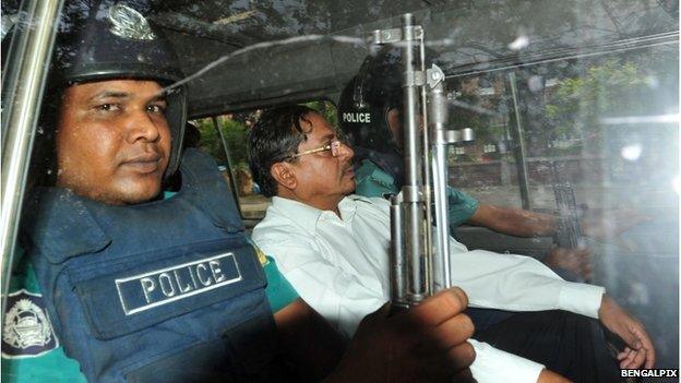 Mohammad Kamaruzzaman deputy head of the Jamaat-e-Islami Political Party being driven either to or from Dhaka Court.