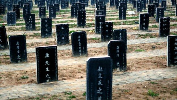 This picture taken on November 25, 2012 shows tombstones at a public cemetery that was built for the 'flatten graves to return farmland' campaign in suburb Zhoukou, central China's Henan province. Zhoukou has halted a campaign to clear graves for farmland after the demolition of more than two million tombs sparked outrage in a country where ancestors are traditionally held in deep respect.