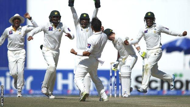 Pakistan celebrate the wicket of Steve Smith on the final day in Abu Dhabi