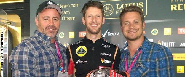 Lotus driver Romain Grosjean tweets a picture of him presenting Matt Le Blanc (left) with a helmet